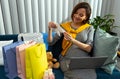Pleased woman preparing baby clothes during her pregnancy Royalty Free Stock Photo