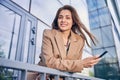 Pleased young woman leaning on the rail Royalty Free Stock Photo