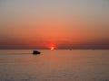 Pleasure boat against the backdrop of a beautiful sea sunset Royalty Free Stock Photo