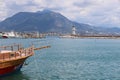 Pleasure boat with lighthouse and mountains in the background in the port of Alanya, Turkey, April 2021 Royalty Free Stock Photo