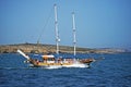 A pleasure boat with lots of sightseers aboard heading back to the sea .