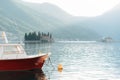 Pleasure boat is moored overlooking the small islands in the Kotor Bay Royalty Free Stock Photo