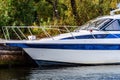 Pleasure boat moored to the pier on the shore of a mountain lake. Fall Royalty Free Stock Photo