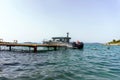 Pleasure boat near the pier on the Aegean Sea. Selective focus.