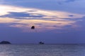 Pleasure boat with a parasailing on sunset on Langkawi island