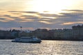 Pleasure boat sailing on the river Neva at sunset. Royalty Free Stock Photo