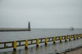 Pleasure boat sails into the harbor in the Baltic Sea. Royalty Free Stock Photo