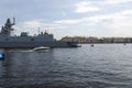 A pleasure boat sails next to the frigate Admiral of the Fleet Kasatonov in St. Petersburg