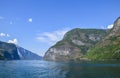 Pleasure boat ship are sailing between fjords. Amazing nature of the Norwegian mountains in Sognefjord. Nature of Norway Royalty Free Stock Photo