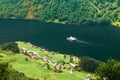 Pleasure Boat Ship Sailing Between Fjords. Village Near Sognefjo Royalty Free Stock Photo