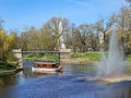 Pleasure boat with tourists cruise along the Riga river canal on background the Freedom Monument Royalty Free Stock Photo