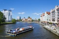 Pleasure boat with tourists is sailing along Pregel, visiting the sights of Kaliningrad Royalty Free Stock Photo