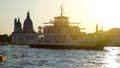 Pleasure boats moving by Venice landmarks at dusk, sightseeing trip for tourists