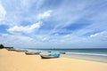 Pleasure boats in sunny beach, Trinkomalee, Sri Lanka. Royalty Free Stock Photo