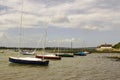 Pleasure boats on their moorings in the historic Bosham Harbour in West Sussex in the South of England Royalty Free Stock Photo