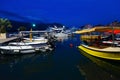 Pleasure boats and yachts at pier on promenade of Budva, Montenegro, evening view Royalty Free Stock Photo