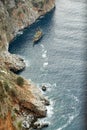 Pleasure craft in the blue Mediterranean sea drifting along the rock coastline of Alanya, Turkey. Top view