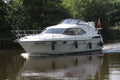 Motor boat cruising on a British canal the Aire and Calder navigation