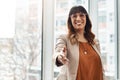 Always a pleasure doing business with you. Portrait of a cheerful young businesswoman reaching out for a handshake in Royalty Free Stock Photo