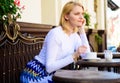 Pleasure on her mind. Woman blonde dreamy smiling face having coffee, urban background defocused. What do girls dream Royalty Free Stock Photo