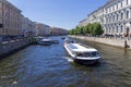 Pleasure and sightseeing boats with tourists. Saint Petersburg, Russia