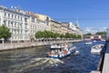 Pleasure and sightseeing boats with tourists. Saint Petersburg, Russia