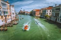 Pleasure tourist boats on Grand Canal and Basilica Santa Maria della Salute, Venice, Italy Royalty Free Stock Photo