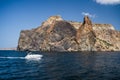 Pleasure tourist speed boat in black sea with volcanic rocks of Cape Fiolent in background, Sevastopol Crimea Royalty Free Stock Photo