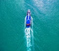 Pleasure white yacht coral reef in blue transparent turquoise water sea. Aerial top view.