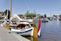 Pleasure yachts and sailboats in the port of Lemmer. Royalty Free Stock Photo