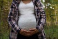 Pleasured pregnant woman autumn park Royalty Free Stock Photo