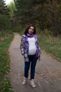 Pleasured pregnant woman autumn park Royalty Free Stock Photo