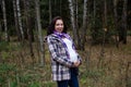 Pleasured pregnant woman autumn park