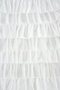 Pleated skirt fabric fashion in white closeup Royalty Free Stock Photo