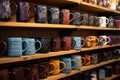 plentiful identical company-branded mugs on shelves