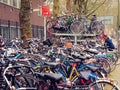 Plenty bicycles parked on the Dutch street, Netherlands, urban h