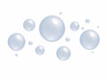 Plenty of bubbles float in the air. Big and small blue water droplets, white background Royalty Free Stock Photo