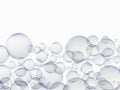 Plenty of bubbles float in the air. Big and small blue water droplets, white background Royalty Free Stock Photo