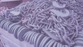 Plenty of green lashing chains in a steel box Royalty Free Stock Photo