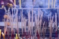 Plenty of incense are burning making a lot of smoke Royalty Free Stock Photo