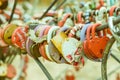 Plenty of multicolored love padlocks on metal railing of the bridge. selective focus, toned