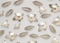 Plenty of silver shining metal leaves. Jewelry findings Royalty Free Stock Photo