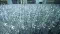 Plenty of unfilled glass bottles in a factory