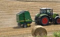 PLERIN, FRANCE -August 06 2018 :Combine harvester roll straw at Plerin