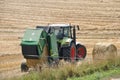 PLERIN, FRANCE -August 06 2018 :Combine harvester roll straw at Plerin