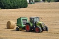 PLERIN, FRANCE -August 06 2018 :Combine harvester roll straw at Plerin