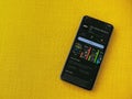 Plex app play store page on smartphone on a yellow fabric background Royalty Free Stock Photo