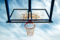 Plexiglass street basketball board with hoop on outdoor court