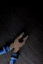 Pliers with a blue handle on a black stone background. Pliers, nippers isolated on black