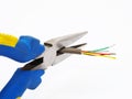 Pliers cutting a cable Royalty Free Stock Photo